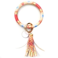 Detail of colorful tassel keychain with golden spring clasp and patterned wristlet ring - Dreamcatcher Tie-Dye