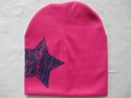 Pink knitted baby beanie with a large navy blue star pattern and soft texture - Blue Pentagram / Rose Red