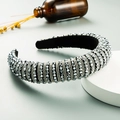 Detailed view of luxury baroque headband featuring gray metallic beads on black fabric - Silver