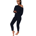 Dettaglio del set due pezzi in maglia nera con maglione con scollo a barca e pantaloni a coste - Taglia S / Nero
