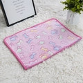 Detailed view of pink flannel pet blanket with colorful bone and paw prints on plush rug - Pink Bone Paw Print