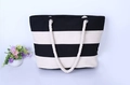 Minimalist canvas tote bag featuring black and white stripes with thick white rope handles - Beige-Black
