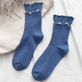 Blue cotton ribbed crew socks with pearl rivet accents and ruffled edges on beige canvas - One Size / Blue