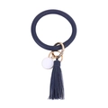 Detailed macro view of dark blue PU leather keychain ring with tassel and gold metal hardware - Navy Blue