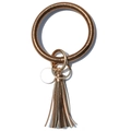 Detailed macro view of bronze PU braided wristlet keychain with long metallic tassels - Tan