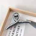 Elegant black claw clip with white pearls featuring a crossed loop design for hair styling - No. 10 Cross Large Black 11cm