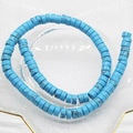 Macro shot of 6x3mm blue turquoise abacus beads with natural black veins on glass - Blue Turquoise