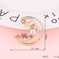 Detailed view of a gold moon and star brooch with colorful rhinestones, size 38mm x 32.5mm - D835 Moon