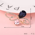 Detail of a butterfly brooch with blue and pink gemstones and sparkling white crystals - D910 Gemstone Butterfly (Royal Blue)