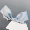 Detail of light blue satin ribbon bow hair clip with a sturdy metal duckbill grip - Duckbill Hair Clips / Grey Blue