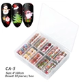 Kerst nagelkunst folieset CA-5 met 10 rollen kerstman en sneeuwpop patronen in een doos - Kerstmis Sterrenhemel Papier 05 (CA-5) / 10 Stuks Verpakking