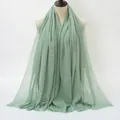 Light green crinkle cotton scarf featuring natural fringe edges for women - Cyan