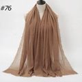 Brown crinkled cotton scarf with frayed edges displayed on a mannequin for women - Coffee