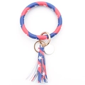 Macro detail of PU leather keychain bracelet with American flag pattern and golden ring - Pentagram
