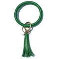 Macro shot of green faux leather wristlet keychain with gold ring and tassel detail - Grass Green