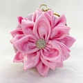 Detail of pink satin flower evening clutch bag with sparkling rhinestone center - Pink