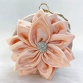 Detail of peach silk petal evening bag with rhinestone flower center and round handle - Champagne