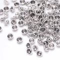 Vintage silver flower bead caps for DIY jewelry making with embossed patterns on white backdrop - GPHJ030