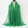Grass green pleated cotton scarf for women featuring frayed edges on a clean white backdrop - Grass Green