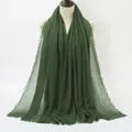 Deep green long crinkle cotton scarf with natural frayed edges on a beige mannequin - 180x90cm / Deep Green (68#)
