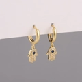Golden Hamsa hand earrings with white cubic zirconia and a central blue stone accent - White Zirconia