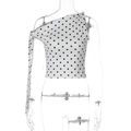 Detailed view of polka dot one-shoulder crop top with decorative tie-knot and side ribbon - S / White