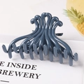 Detail of dark blue-grey geometric hair claw clip with wave-shaped teeth on white background - 10.5CM Large / Dark Blue