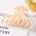 Minimalist beige geometric plastic claw clip shown on a white decorative book - 10.5CM Large / Nude