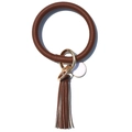 Macro detail of brown leather keychain with gold ring, tassel, and round white pendant - Dark Brown