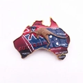 Macro detail of Australia map souvenir pin with enamel colors and kangaroo relief - Australia Kangaroo Map