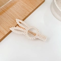 Elegant gold metal hair clip featuring white pearls in a twisted infinity design - Rabbit Duckbill Clip