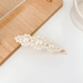 Elegant gold metal hair clip featuring three large pearls with small pearl accents - Three Flowers