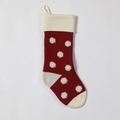 Close-up of red knitted Christmas stocking with white 3D polka dots and a hanging loop - Burgundy Body / Ivory Dots
