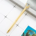 Elegant golden metal ballpoint pen with a large diamond crystal top and bullet tip - Electroplated Gold