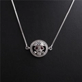 Detail of silver skull pendant necklace with red eye gems and clear crystal accents - Skull Style 1 White Gold