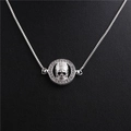 Macro view of silver skull pendant with clear zircons and delicate box chain detail - Skull Style 2 White Gold