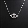 Detailed macro of a silver skull pendant necklace with sparkling crystal ring accents - Skull Style 4 White Gold