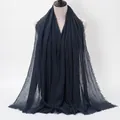 Navy blue crinkled cotton hijab scarf with frayed edges shown on a mannequin - Dark Blue