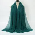 Dark green crinkled cotton scarf featuring a fine fringed edge for a minimalist look - Dark Green