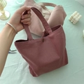 Detailed view of canvas tote bags with magnetic snaps and fine ribbed texture - Dusty Rose