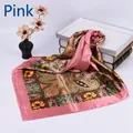 Detail of pink silk scarf with vintage paisley patterns and floral print on white base - Pink