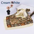 Close-up of off-white satin square scarf with vintage paisley patterns and floral prints - Beige
