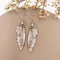 Macro detail of silver cicada wing earrings with resin texture and sparkling crystals - Brown Rhinestone-Bronze