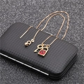 Detailed view of gold necklace with red stone lock and key pendant on a black gift box - Style 3 Red Gemstone Lock and Key