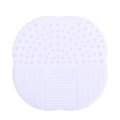 White silicone makeup brush cleaning pad in clover shape with textured scrubbing surface - White