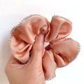 Luxe coral satin scrunchie with sparkling rhinestone trim and elegant silk texture - Hot Pink