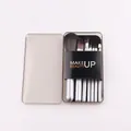 Detail of 6-piece portable makeup brush set with silver handles in a clear storage box - Gray