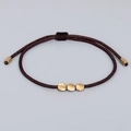 Handmade woven dark brown rope bracelet with three matte gold copper beads and adjustable pull - Dark Coffee