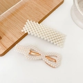 Elegant 2-piece set of white pearl and gold alloy hair clips on a minimalist background - Quiet 2-Piece Set