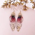 Detailed view of handmade cicada wing earrings with purple gradients and gold foil accents - Purple-Gold Foil